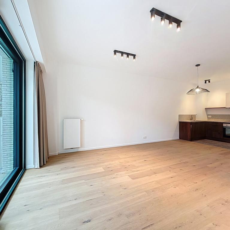 Immeuble The W : Appartement neuf 1ch près UCL avec terrasse