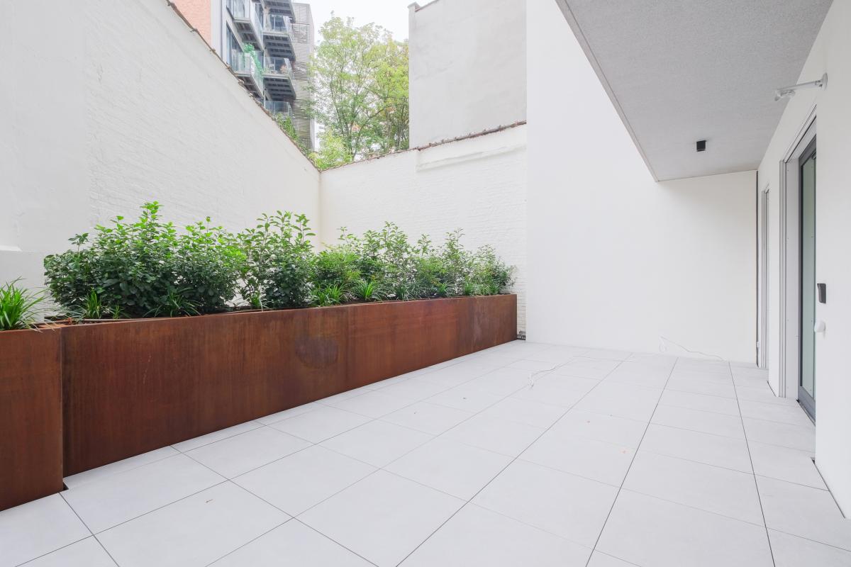 Rez-de-chaussée neuf de standing avec terrasse à Ixelles