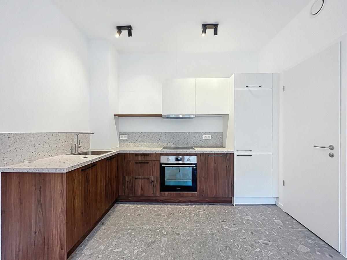 Immeuble The W : Appartement neuf 1ch près UCL avec terrasse